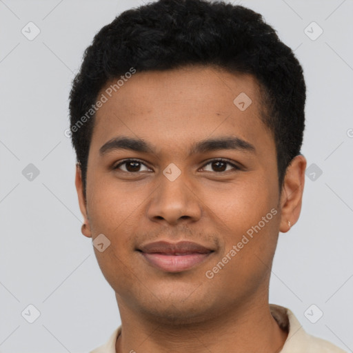 Joyful latino young-adult male with short  brown hair and brown eyes