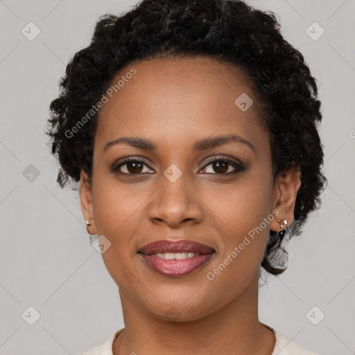 Joyful black young-adult female with short  brown hair and brown eyes