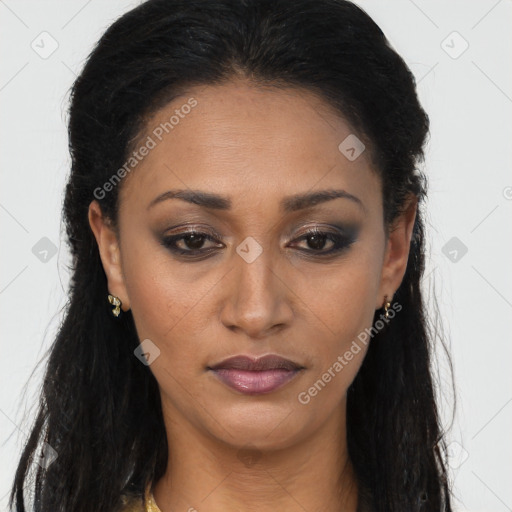 Joyful latino young-adult female with long  brown hair and brown eyes