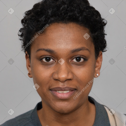 Joyful black young-adult female with short  black hair and brown eyes