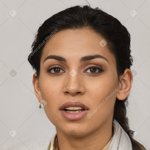 Joyful latino young-adult female with long  brown hair and brown eyes