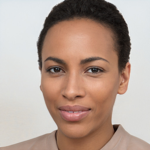 Joyful latino young-adult female with short  brown hair and brown eyes