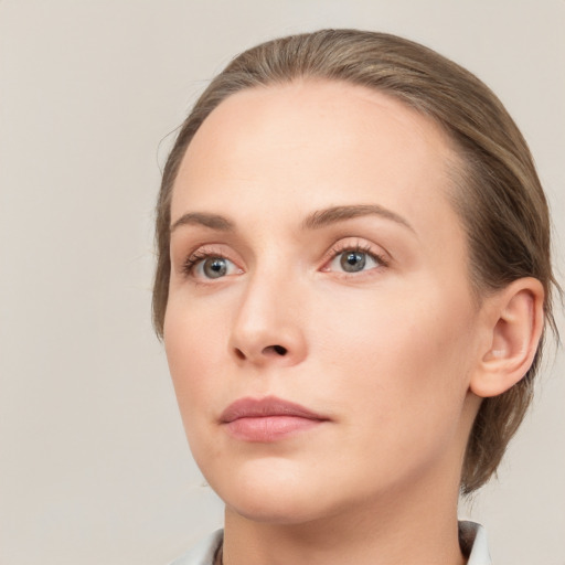 Neutral white young-adult female with medium  brown hair and grey eyes