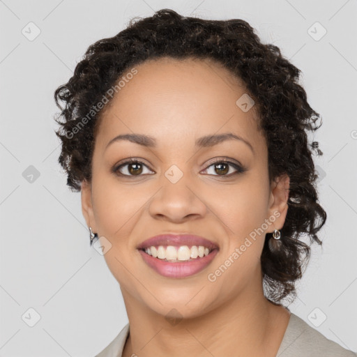 Joyful black young-adult female with medium  brown hair and brown eyes