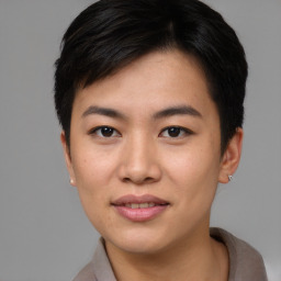 Joyful asian young-adult female with short  brown hair and brown eyes