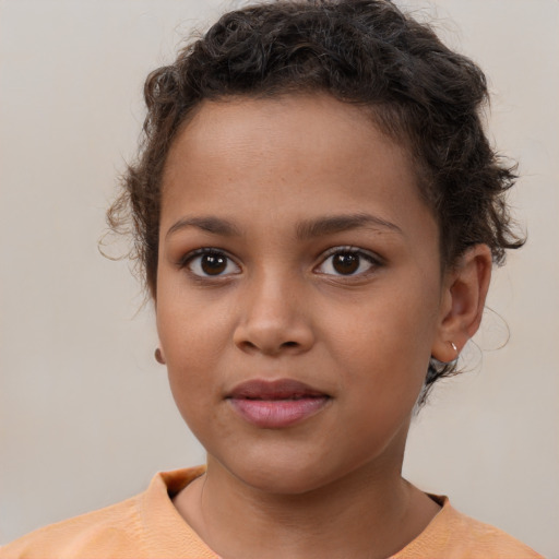 Joyful white child female with short  brown hair and brown eyes