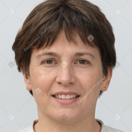 Joyful white adult female with short  brown hair and brown eyes