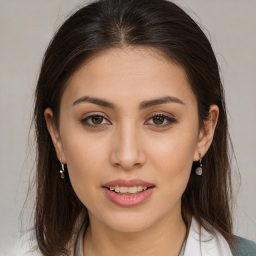 Joyful white young-adult female with medium  brown hair and brown eyes