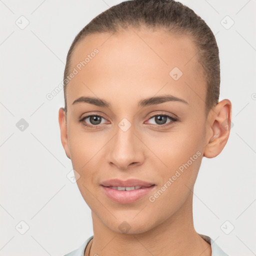 Joyful white young-adult female with short  brown hair and brown eyes