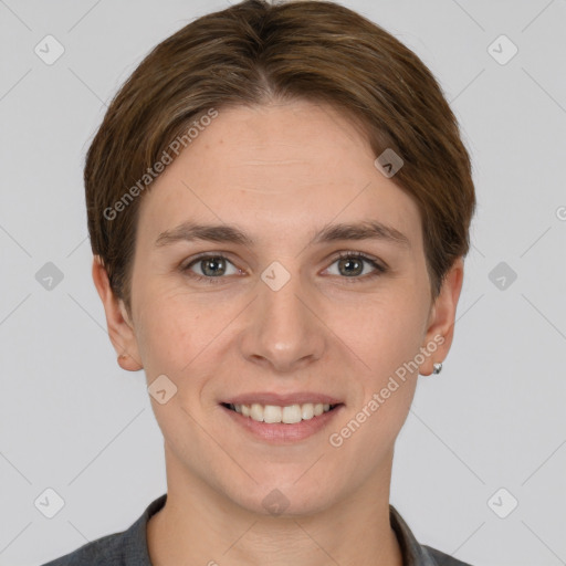 Joyful white young-adult female with short  brown hair and grey eyes