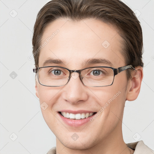 Joyful white young-adult female with short  brown hair and grey eyes