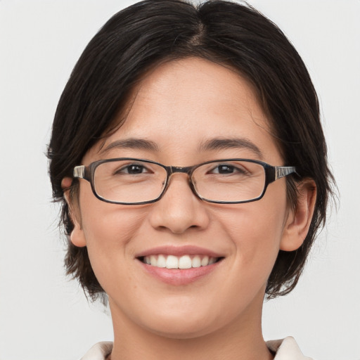 Joyful white young-adult female with medium  brown hair and brown eyes