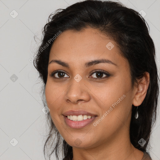 Joyful latino young-adult female with long  brown hair and brown eyes