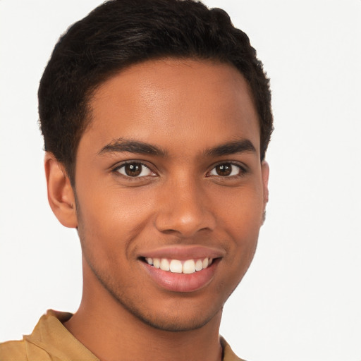 Joyful black young-adult male with short  brown hair and brown eyes