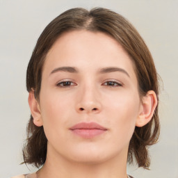 Neutral white young-adult female with medium  brown hair and brown eyes