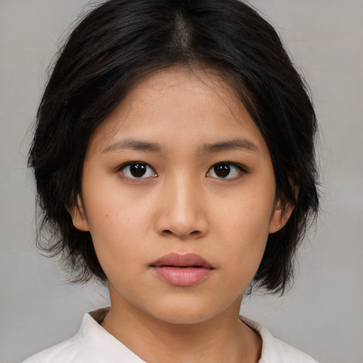 Neutral asian young-adult female with medium  black hair and brown eyes