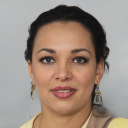 Joyful latino young-adult female with short  brown hair and brown eyes