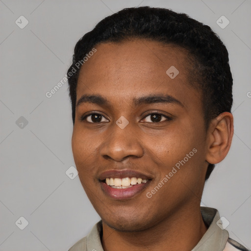 Joyful black young-adult female with short  black hair and brown eyes