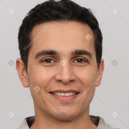 Joyful white young-adult male with short  black hair and brown eyes