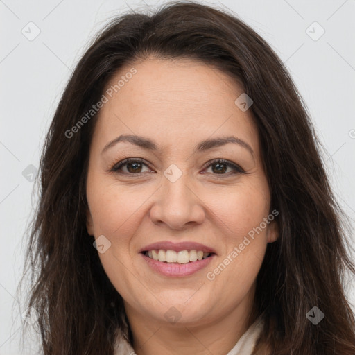 Joyful white adult female with long  brown hair and brown eyes