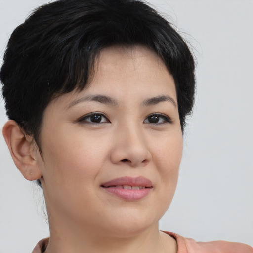 Joyful asian young-adult female with short  brown hair and brown eyes