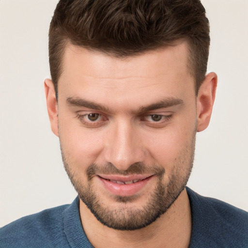 Joyful white young-adult male with short  brown hair and brown eyes