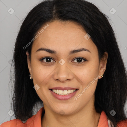 Joyful latino young-adult female with long  brown hair and brown eyes