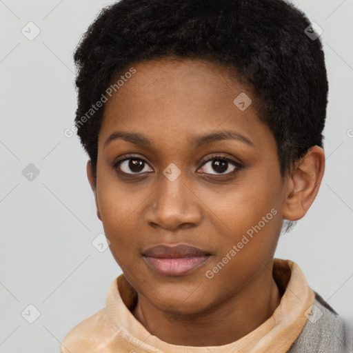 Joyful black young-adult female with short  black hair and brown eyes