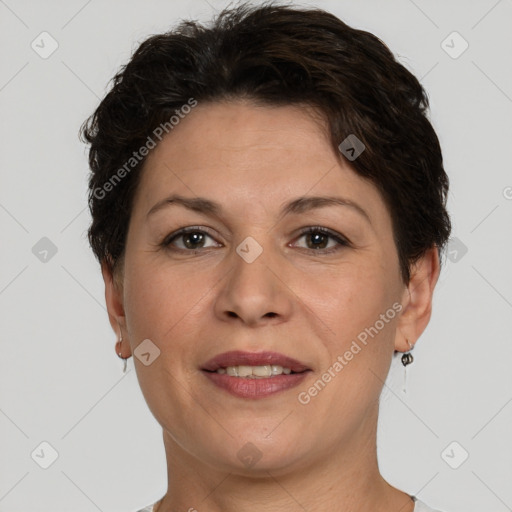 Joyful white adult female with short  brown hair and brown eyes