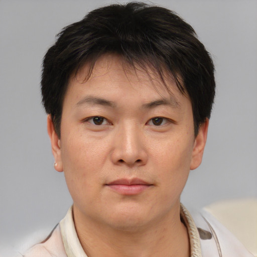 Neutral asian young-adult male with short  brown hair and brown eyes