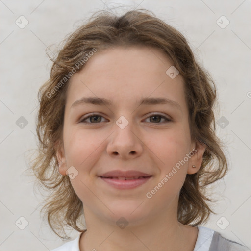 Joyful white child female with medium  brown hair and brown eyes