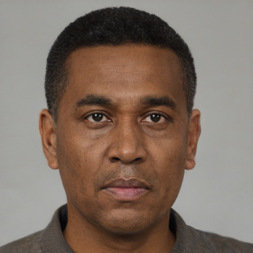 Neutral black adult male with short  black hair and brown eyes