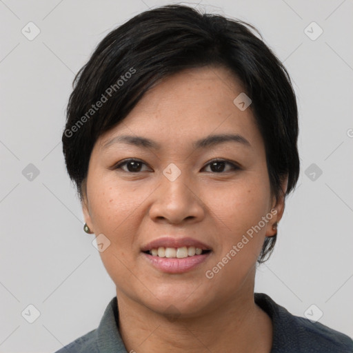 Joyful asian young-adult female with short  black hair and brown eyes