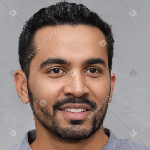 Joyful latino young-adult male with short  black hair and brown eyes