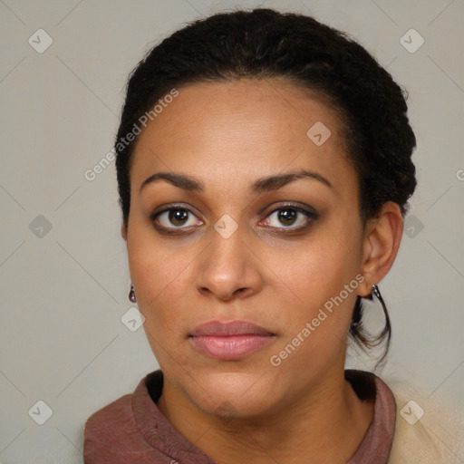 Joyful black young-adult female with short  brown hair and brown eyes