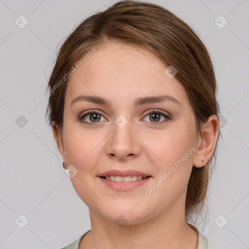 Joyful white young-adult female with medium  brown hair and grey eyes