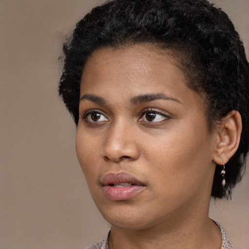 Neutral black young-adult female with short  black hair and brown eyes