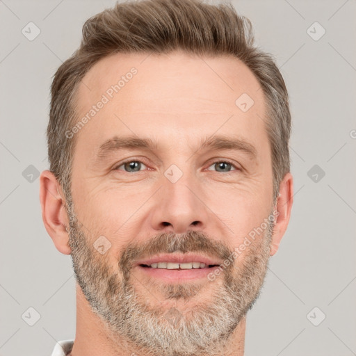 Joyful white adult male with short  brown hair and grey eyes