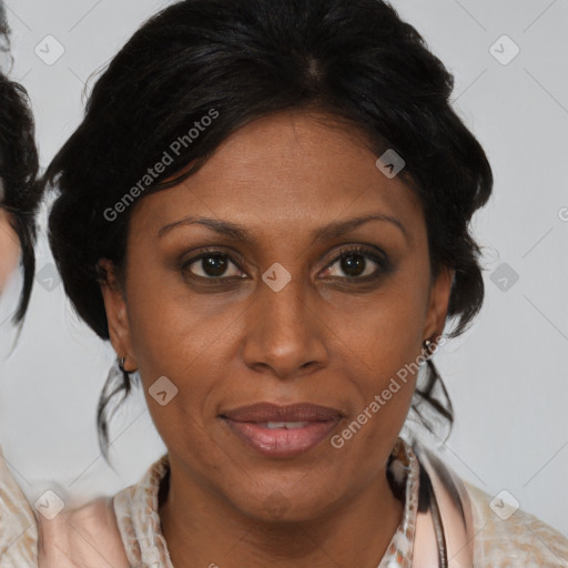 Joyful black adult female with medium  brown hair and brown eyes