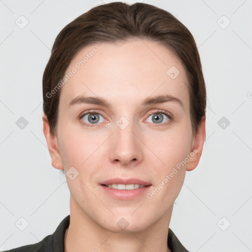 Joyful white young-adult female with short  brown hair and grey eyes