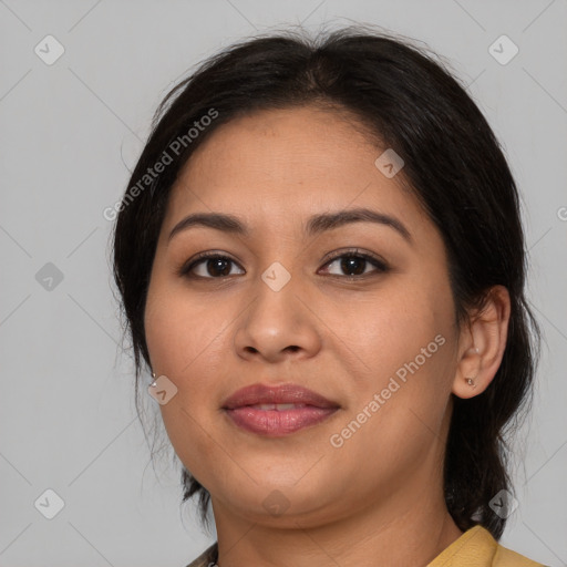 Joyful latino young-adult female with medium  brown hair and brown eyes