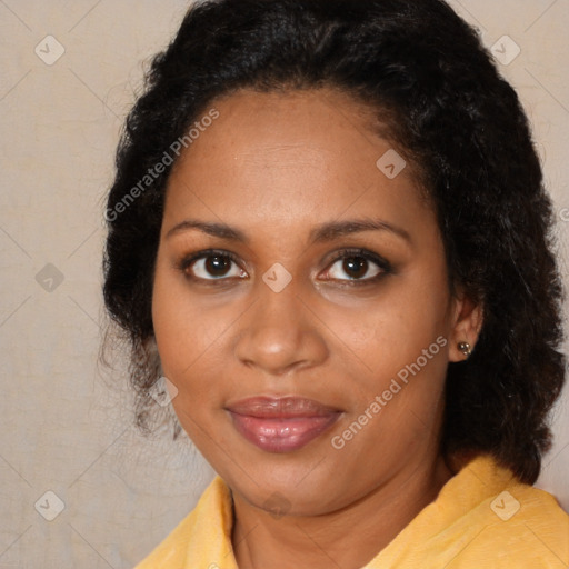 Joyful black adult female with medium  brown hair and brown eyes