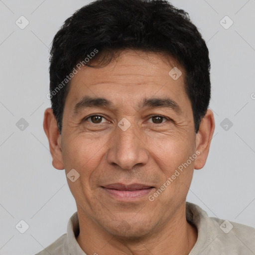 Joyful white adult male with short  black hair and brown eyes