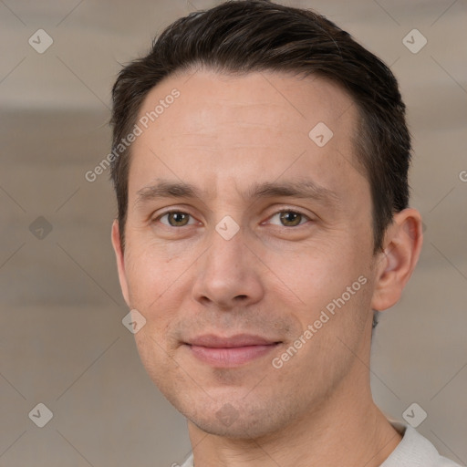 Joyful white adult male with short  brown hair and brown eyes