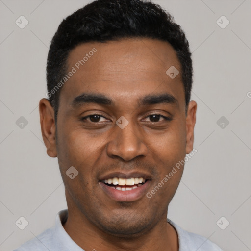 Joyful black young-adult male with short  black hair and brown eyes