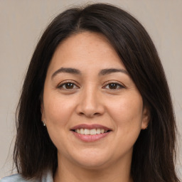 Joyful white adult female with medium  brown hair and brown eyes