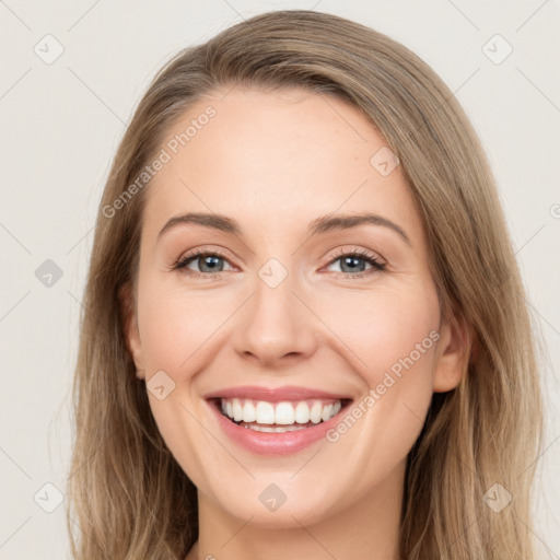 Joyful white young-adult female with long  brown hair and green eyes