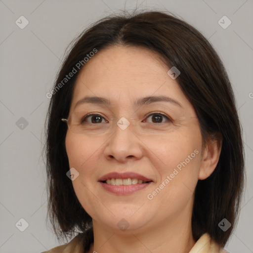 Joyful white adult female with medium  brown hair and brown eyes