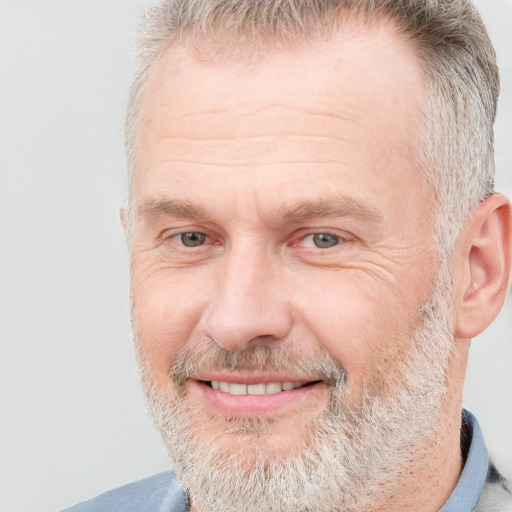 Joyful white middle-aged male with short  brown hair and brown eyes