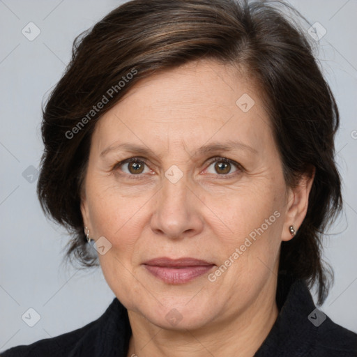 Joyful white adult female with medium  brown hair and brown eyes